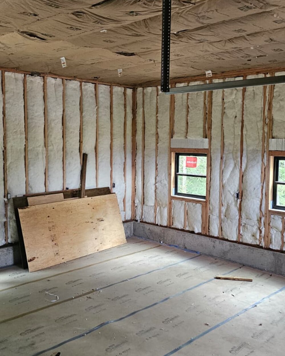 Framed interior walls with insulation before drywall